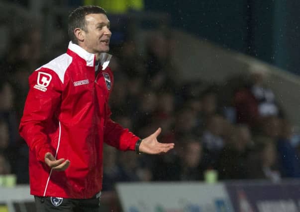 Ross County Manager Jim McIntyre gives out instructions from the dugout. Picture: SNS Group