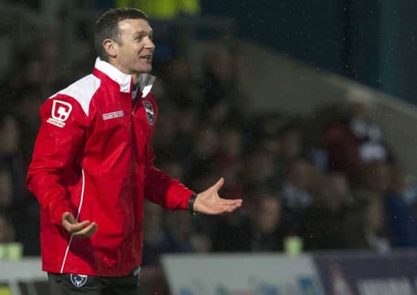 Ross County Manager Jim McIntyre gives out instructions from the dugout. Picture: SNS Group