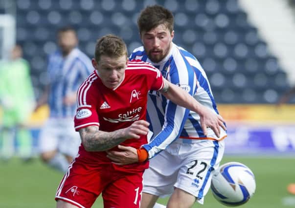 Aberdeen's Jonny Hayes, left, battles with Darryl Westlake. Picture: SNS