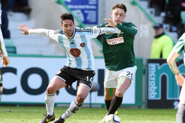 Hearts' Miguel Pallardo, left, battles with Scott Allan. Picture: SNS