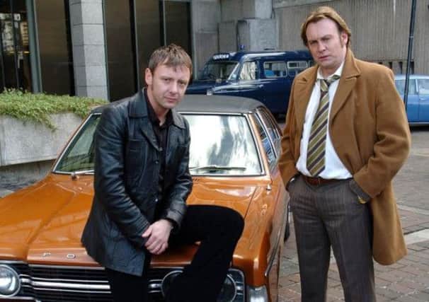 Philip Glenister with John Simm on Life on Mars. Picture: Neil Jones/PA Wire.