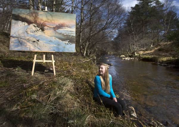 Great-grand-niece of the Scottish artist Joseph Farquharson, Izzy Farquharson with an original painting by Farquharson. Picture: PA