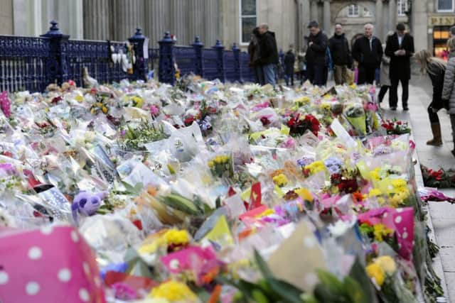 Floral tributes left for the victims of the bin lorry crash. Picture: John Devlin