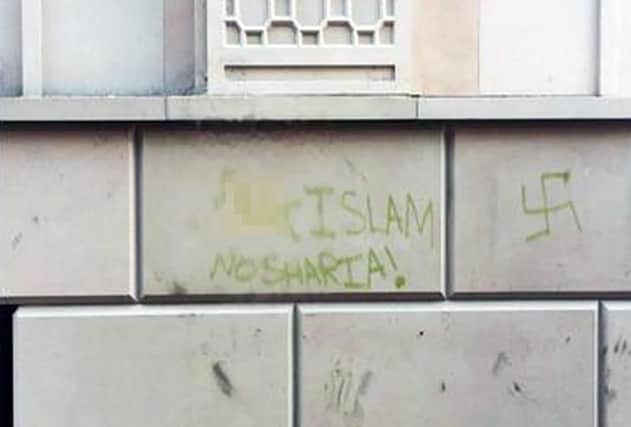 The graffiti on the wall of the Central Gurdwara in Berkeley Street.