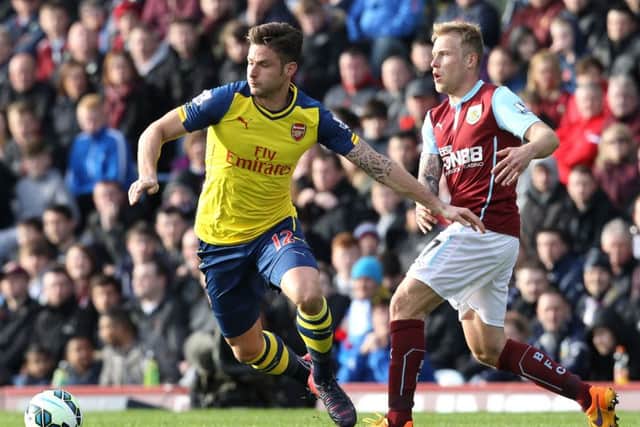 Olivier Giroud holds off Scott Arfield as Arsenal take on Burnley in the English Premier League. Picture: Getty