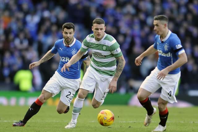Anthony Stokes shields the ball from Fraser Aird and Richard Foster of Rangers. Picture: John Devlin