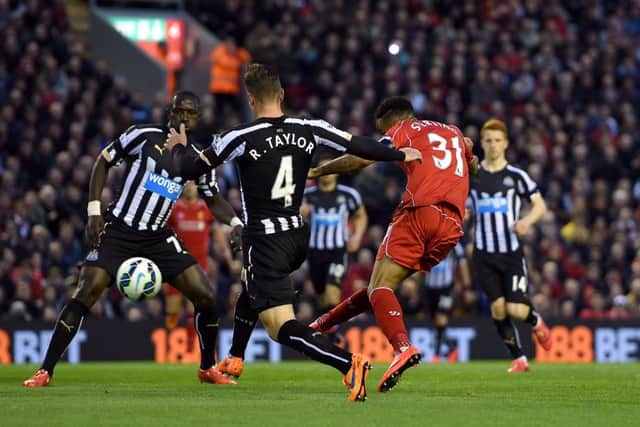 Raheem Sterling scores Liverpools first goal in their 20 victory against Newcastle at Anfield. Picture: PA