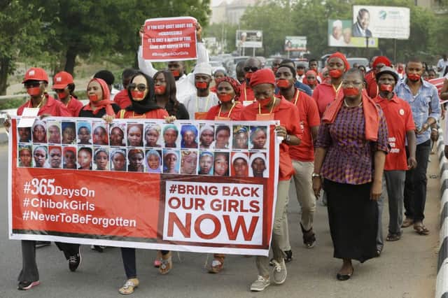 People in Abuja march at a silent protest over the schoolgirls who were abducted from Chibok. Picture: AP