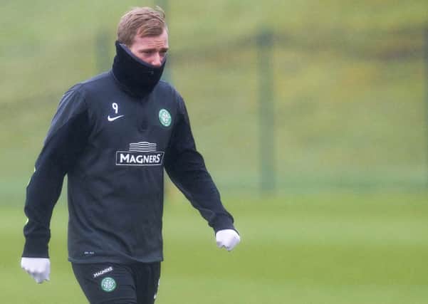 John Guidetti wraps up against the elements as Celtic prepare for the match against Kilmarnock. Picture: SNS