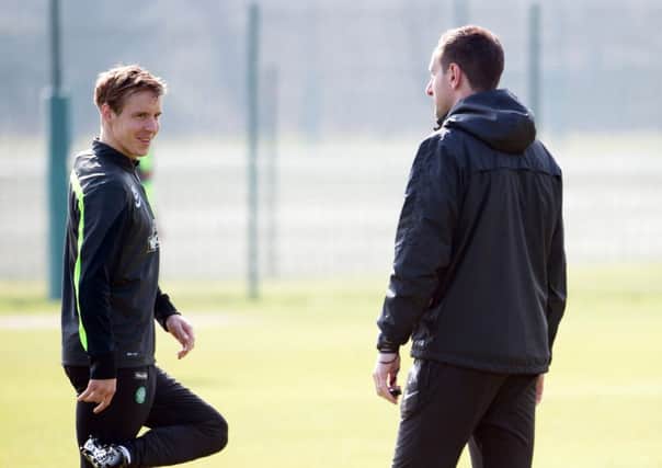 Celtic manager Ronny Deila, right, speaks with Stefan Johansen. Picture: SNS