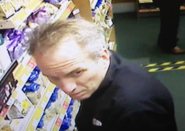 A CCTV image of a balding man being hunted by police over the shoplifting of hair growth products. Picture: PA