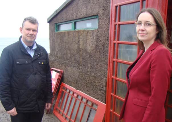Eilidh Whiteford with Troup SNP councillor Ross Cassie inspecting the  telephone box made famous by the film Local Hero. Picture: Contributed