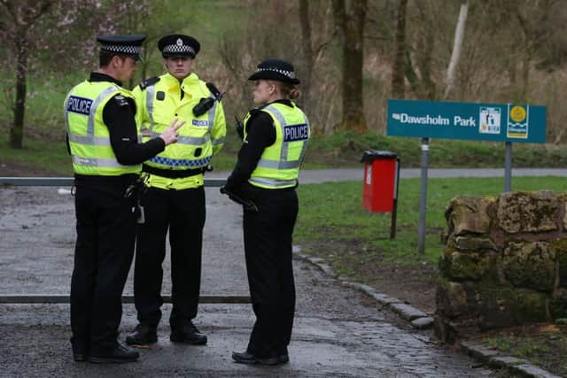 Police outside Dawsholm Park in Glasgow where a handbag believed to belong to Karen Buckley was found. Picture: PA