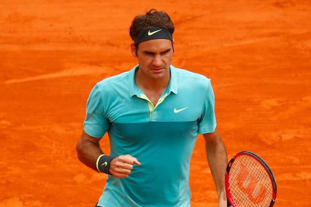 Roger Federer celebrates winning a point against Jeremy Chardy. Picture: Getty