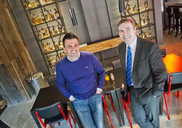 Gary Thomson, left, and Paul McWilliams mark the new Cowgate opening. Picture: Chris Watt
