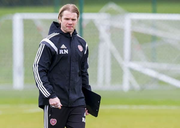 Hearts head coach Robbie Neilson watches over training. Picture: SNS