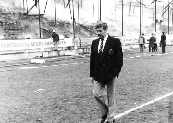 Former Bradford chairman Stafford Heginbotham wanders around the club's ground after a fire that killed 56 supporters in 1985. Picture: Ross Parry/SWNS