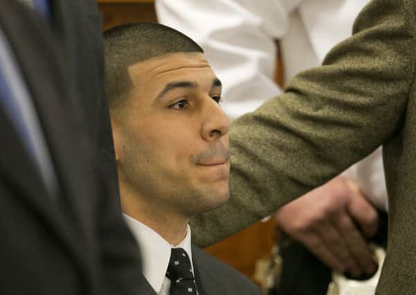 Former New England Patriots football player Aaron Hernandez listens as the guilty verdict is read during his murder trial. Picture: AP