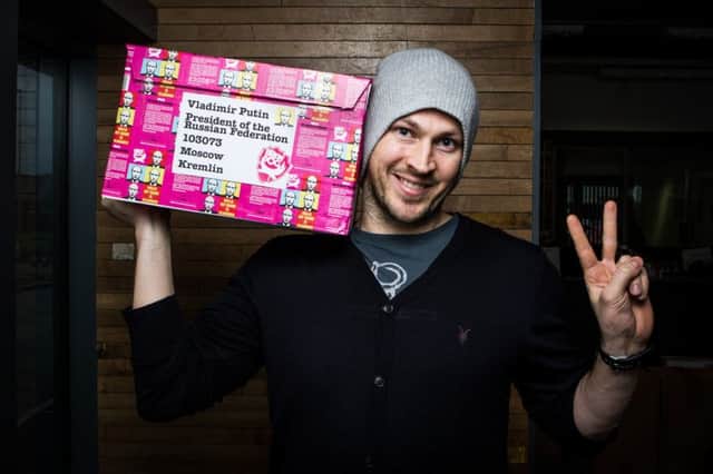 Brewdog's James Watt poses with a protest beer destined for the Russian president. Picture: Contributed