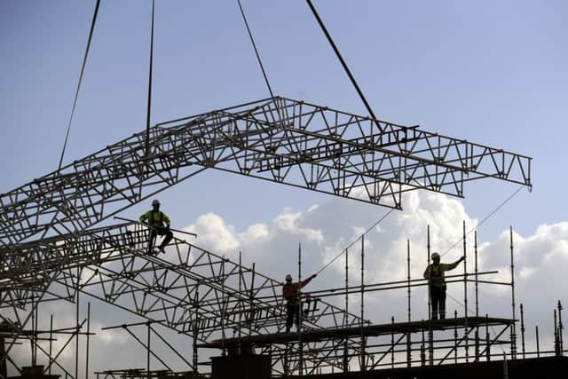 A section of roofing is lowered onto the Mackintosh Building last October. Picture: John Devlin