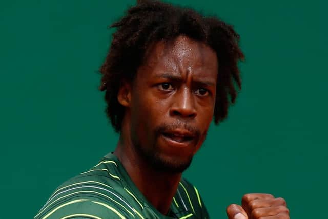Gael Monfils celebrates during his win over Roger Federer. Picture: Getty