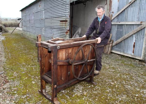 Leslie Foubister, from Toab, demonstrates a pedal-operated threshing machine. Picture: Tom OBrien