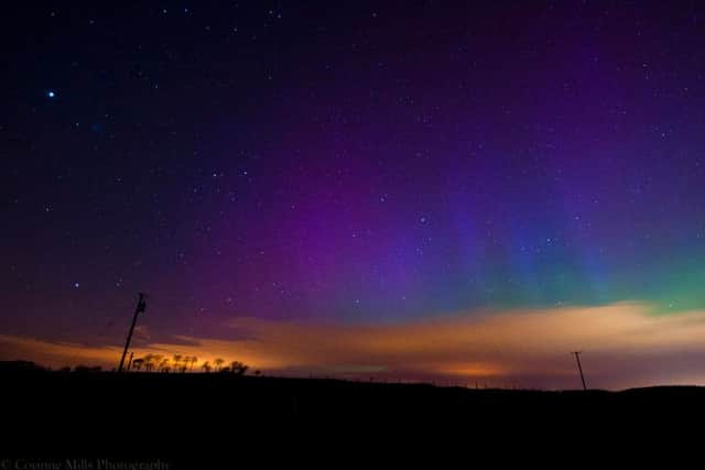The Northern Lights seen above Dundee, as seen from north east Fife. Picture: Corinne Mills