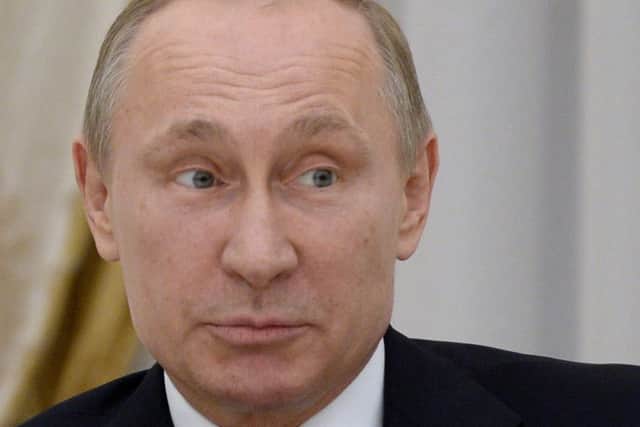 Vladimir Putin denies claims his troops crossed the border. Picture: AFP/Getty