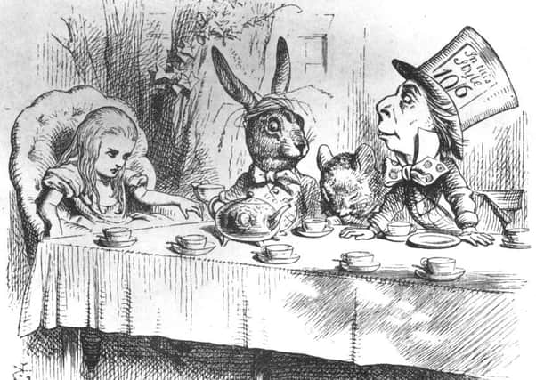 1865:  Alice, the March Hare, the dormouse and the mad hatter at the latter's tea party. Picture: Getty