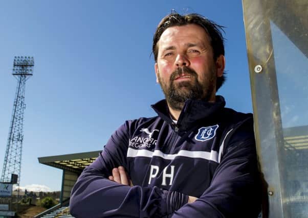Paul Hartley has signed a new deal after leading Dundee into the top six of the top flight. Picture: SNS
