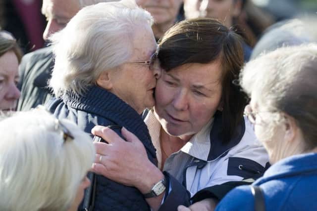 Marian Buckley, second right, the mother of Karen Buckley, is comforted. Picture: PA