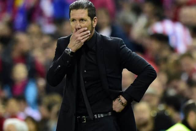 Atletico coach Diego Simeone, right, achieved a miracle by winning La Liga. Picture: Getty