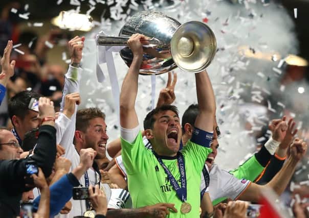Iker Casillas of Real Madrid lifts the Champions League trophy after victory over Atletico last year. Picture: Getty
