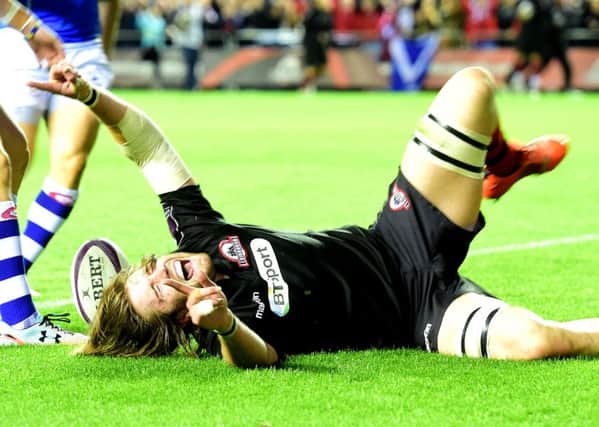 Edinburgh second row forward Ben Toolis celebrates after touching down a try in the second half. Picture: SNS