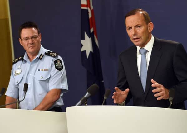 Tony Abbott (right) and Michael Phelan address a media conference. Picture: Getty
