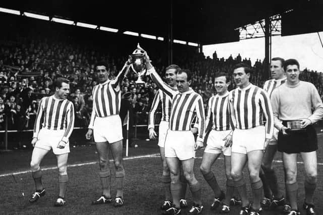 Kilmarnocks £25-a-week players with the 1964-65 league trophy. The title was won with a 2-0 victory against red-hot favourites Hearts at Tynecastle. Picture: Contributed