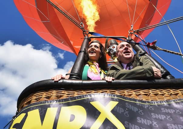 SNP candidate for Perthshire South and Ochil, Tasmina Ahmed Sheikh, is joined by Alex Salmond during campaigning in Milnathort, Scotland. Picture: Getty