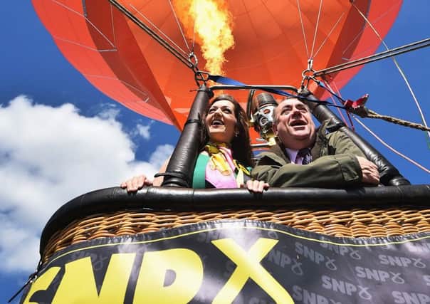 SNP candidate for Perthshire South and Ochil, Tasmina Ahmed Sheikh, is joined by Alex Salmond during campaigning in Milnathort, Scotland.  Picture: Getty