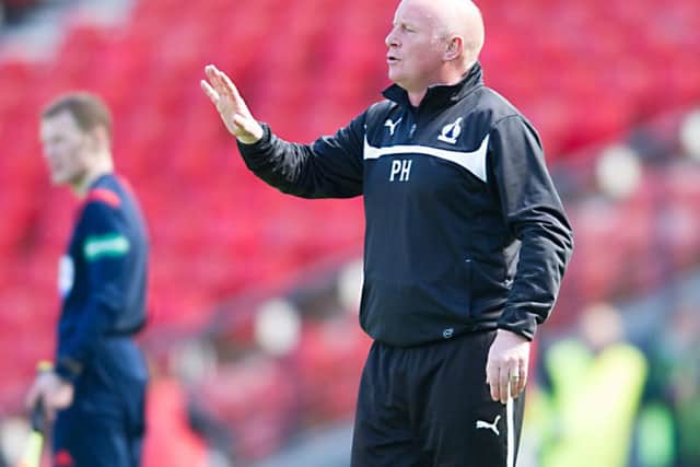 Peter Houston looks on as Falkirk withstand Hibspressure                Picture: John Devlin
