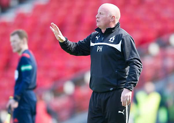 Peter Houston looks on as Falkirk withstand Hibspressure                Picture: John Devlin