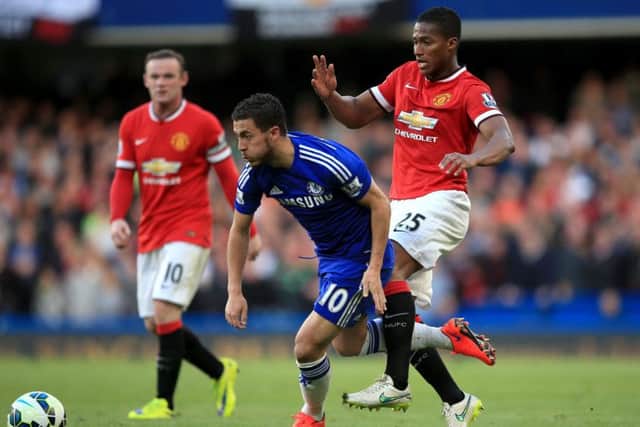 Manchester Uniteds Antonio Valencia, right, battles Chelsea scorer Eden Hazard for the ball at Stamford Bridge. Picture: Nick Potts/PA