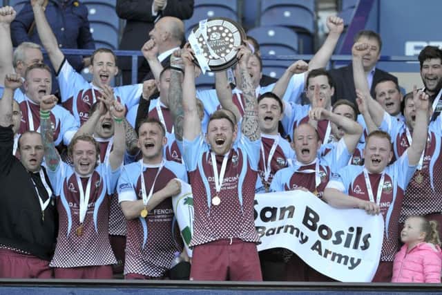 St Boswells celebrate with captain Ryan Hogg holding up the BT Shield. Picture: Ian Rutherford