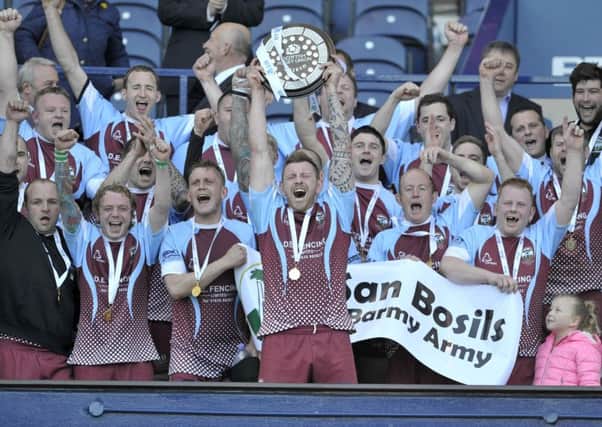 St Boswells celebrate with captain Ryan Hogg holding up the BT Shield. Picture: Ian Rutherford