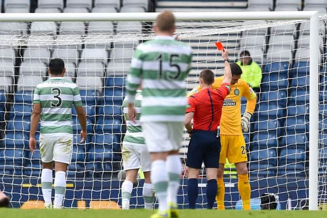Celtic goalkeeper Craig Gordon (right) is shown a red card by referee Steven McLean. Picture: SNS