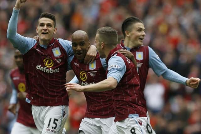 Aston Villas Fabian Delph, second left, celebrates with his teammates. Picture: AP