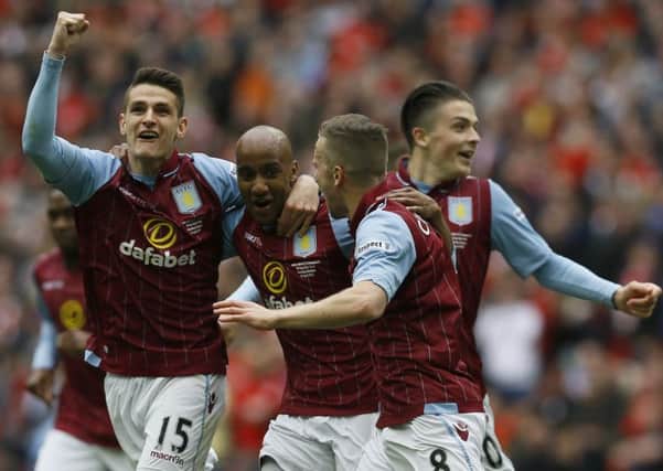 Aston Villas Fabian Delph, second left, celebrates with his teammates. Picture: AP