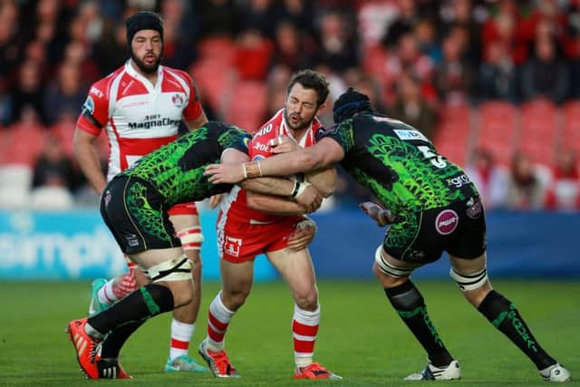 Gloucester's Greig Laidlaw is tackled by Exeter's Mitch Lees and Kai Horstmann. Picture: PA