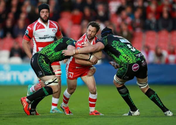 Gloucester's Greig Laidlaw is tackled by Exeter's Mitch Lees and Kai Horstmann. Picture: PA