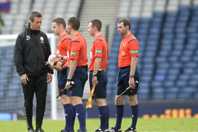 Ronny Deila speaks to the 4 officials at the end of the game. Picture: SNS