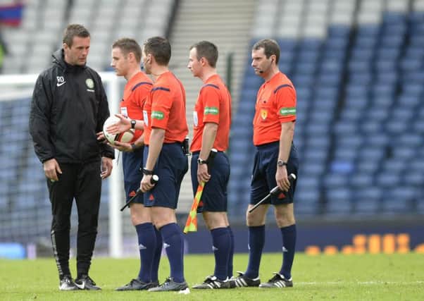 Ronny Deila speaks to the 4 officials at the end of the game. Picture: SNS